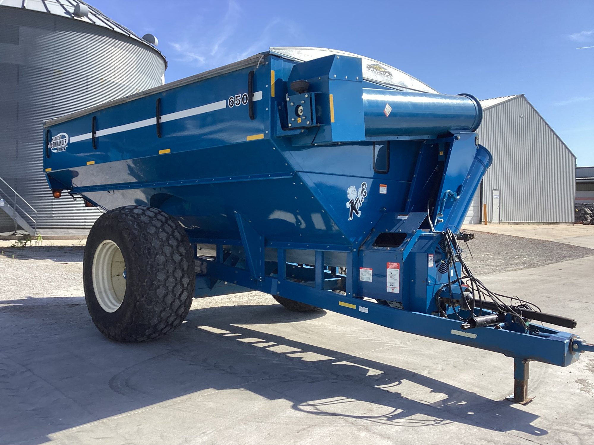 A Kinze grain cart parked on the Blue Equipment lot