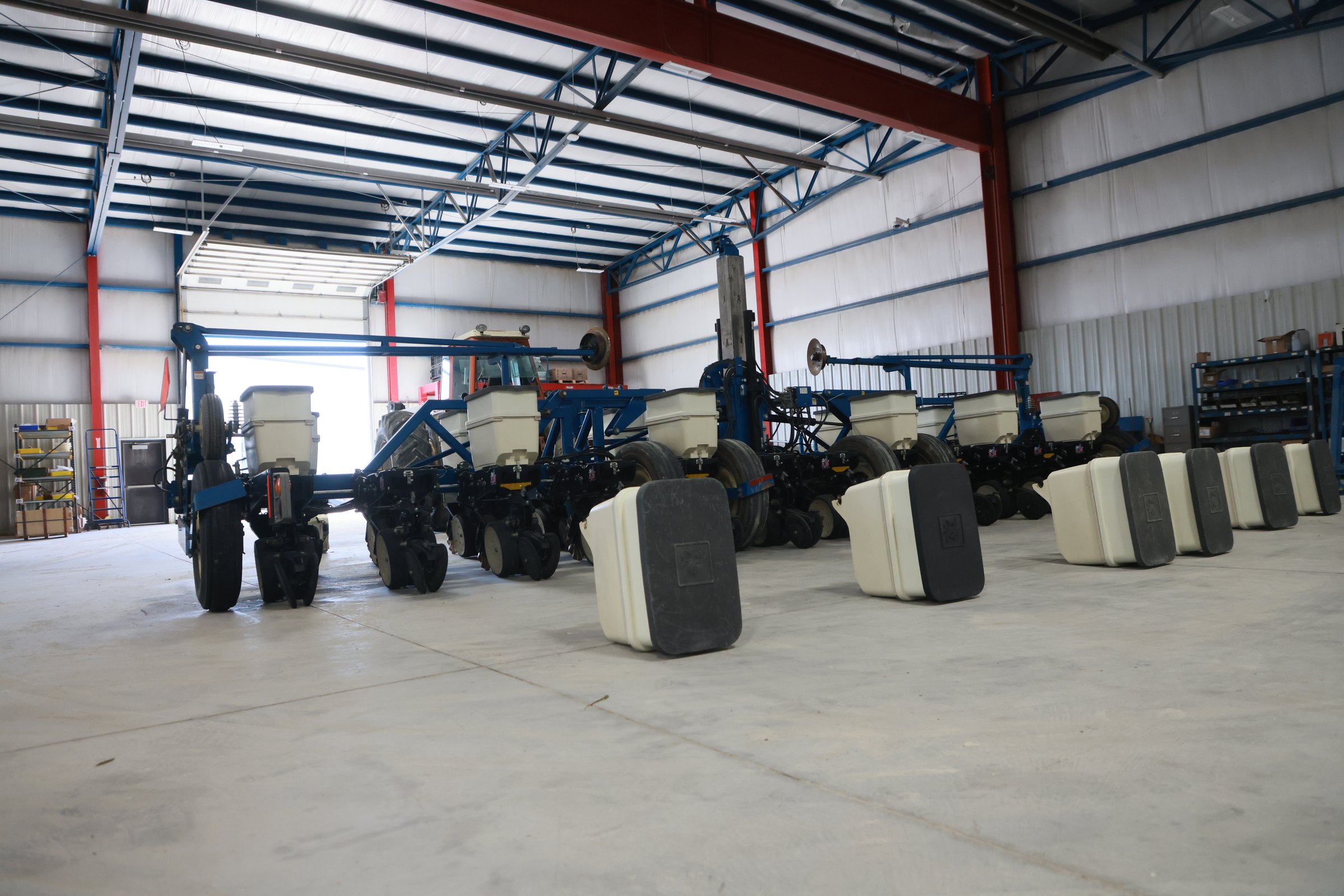 Kinze planters lined up in the Blue Equipment service shop for their seasonal inspection
