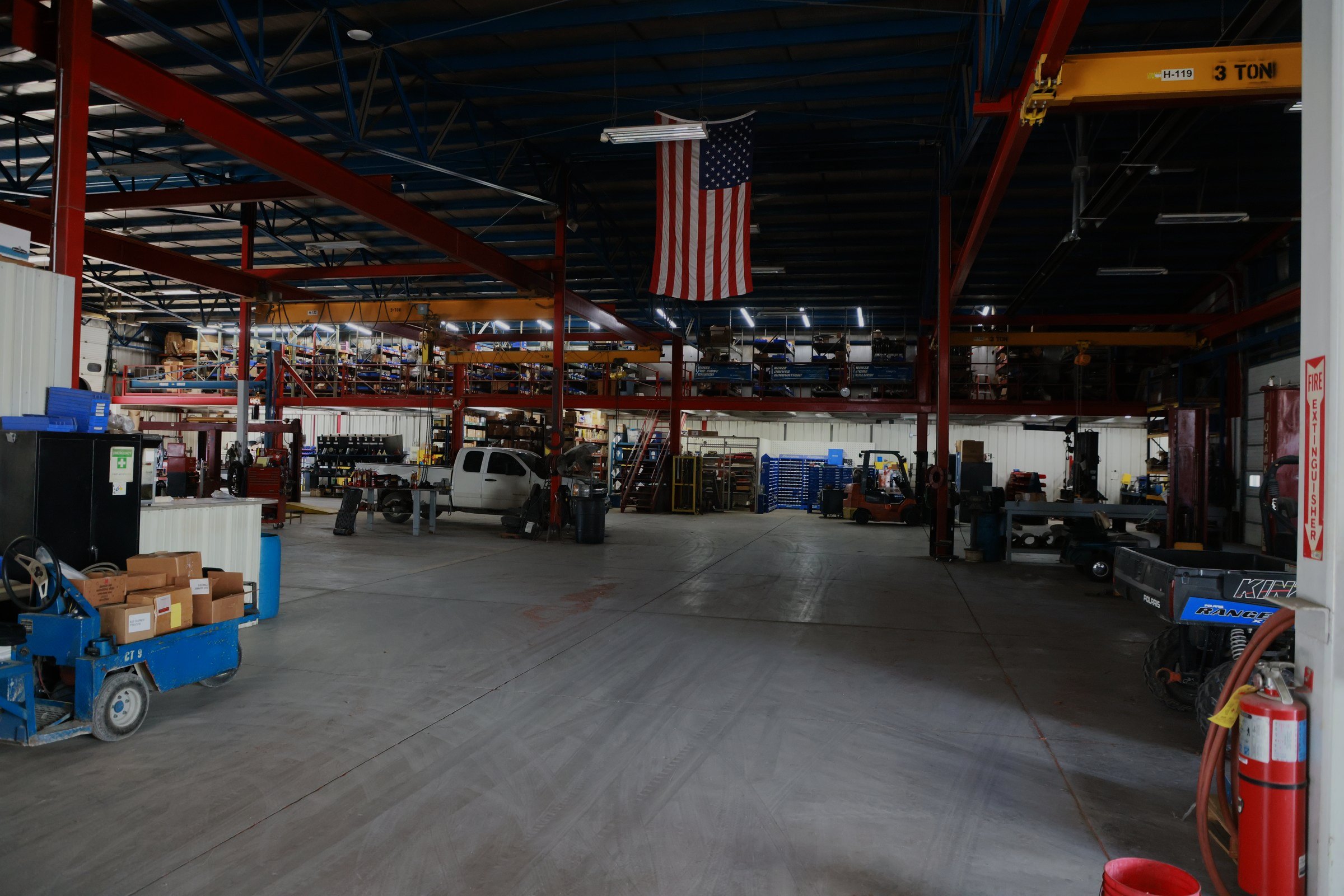Inside the Blue Equipment shop, with overhead cranes, the service floor and the parts mezzanine