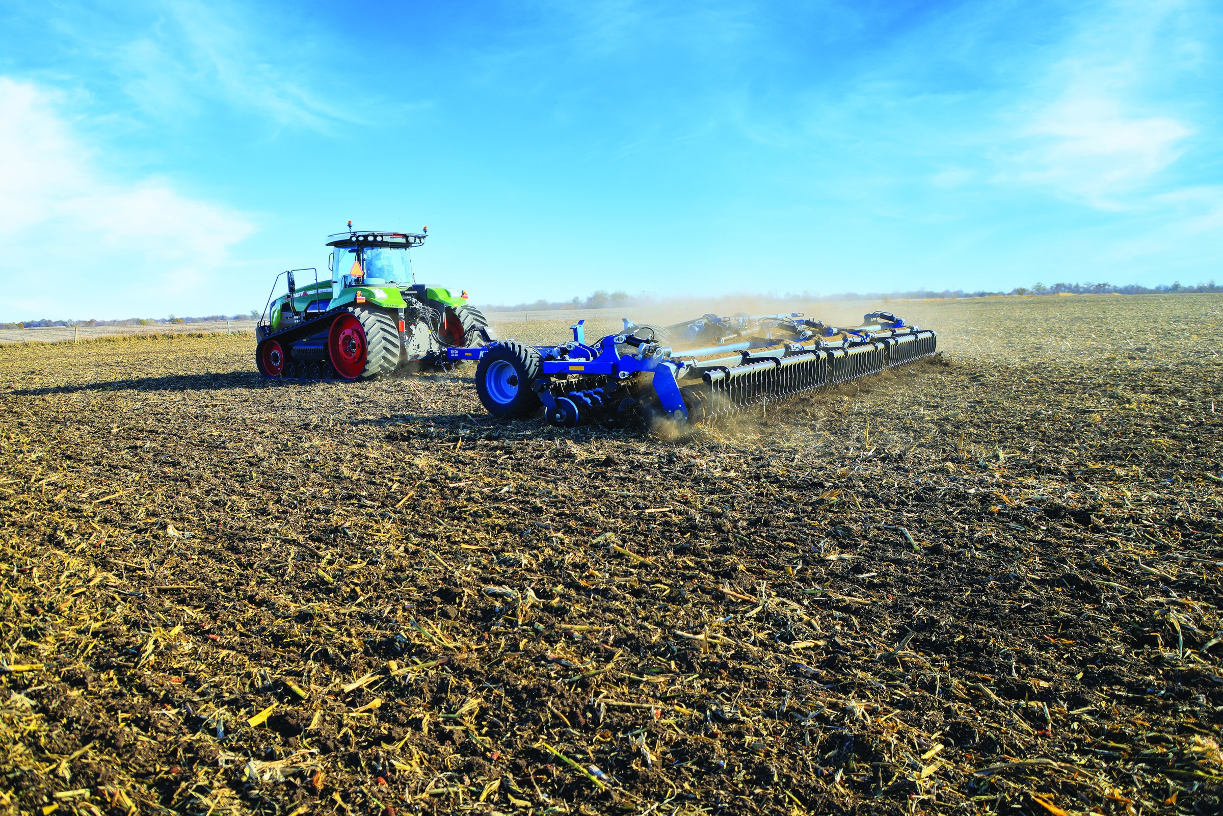 A Kinze Mach Till 362 high-speed disk working a field of corn stalks